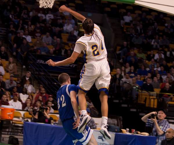 Jordan Rezendes elevates to reject a Bedford players attempt at TD Garden on Monday. BY ANDREW W. GRIFFITH